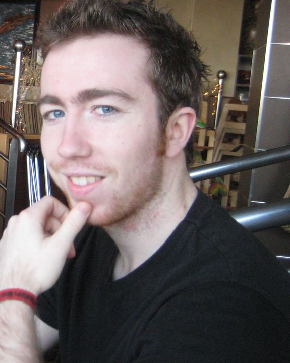 A younger Ryan, chin in hand