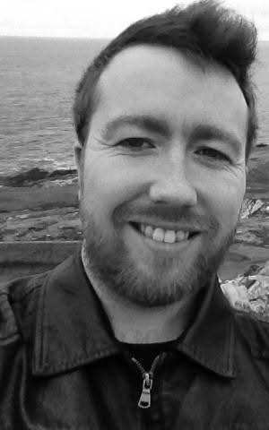 Smiling selfie on the cliffs above the sea